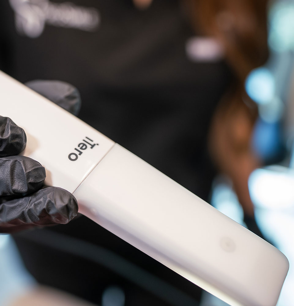 team member taking a 3d scan of Patients teeth