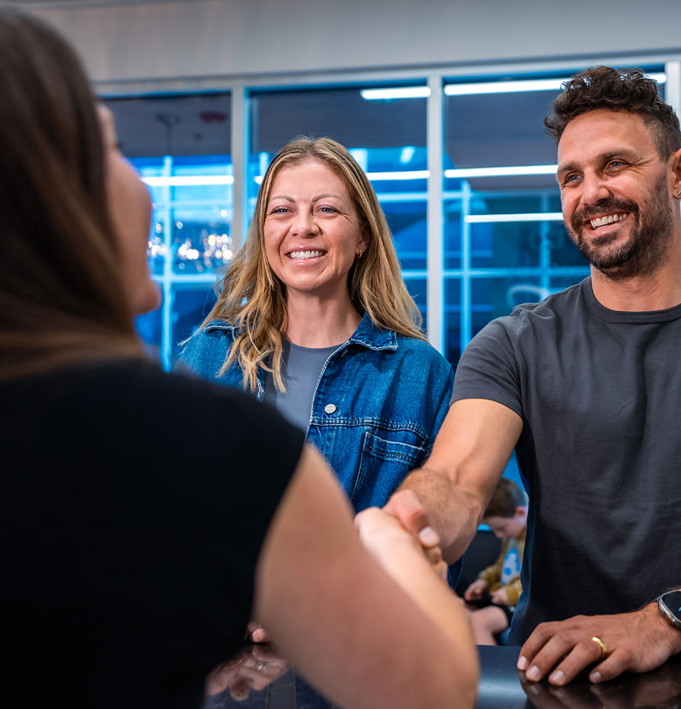 team member greeting Patients into dental office